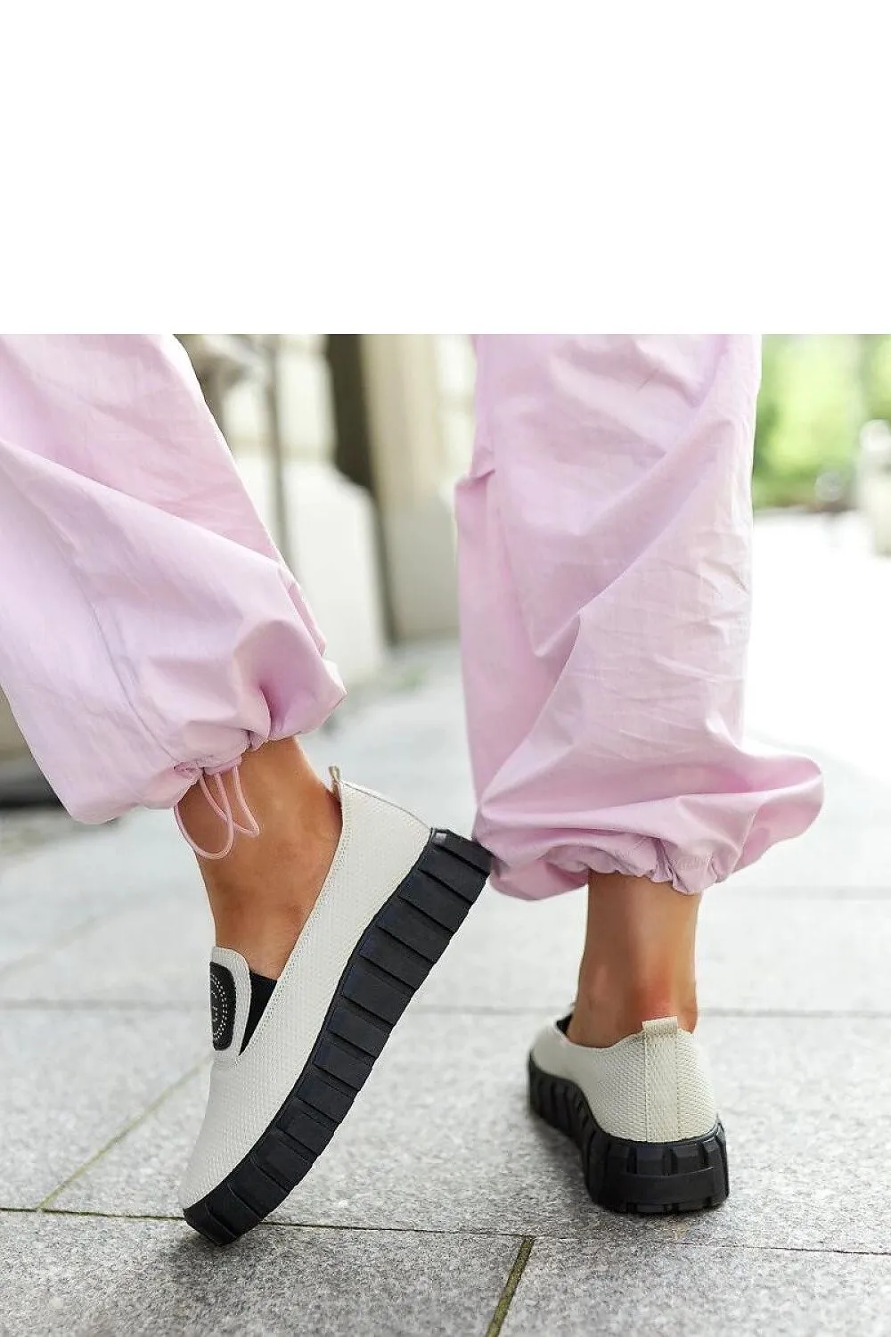 Black loafers on a massive sole