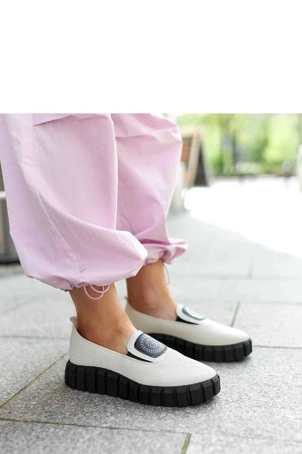 Black loafers on a massive sole