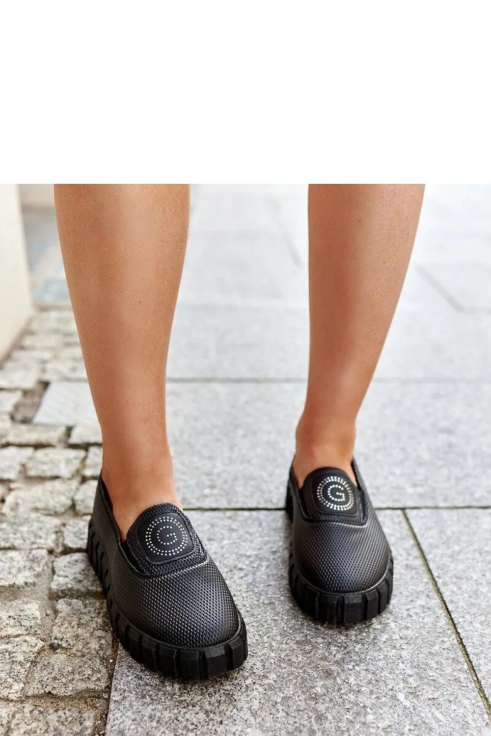 Black loafers on a massive sole