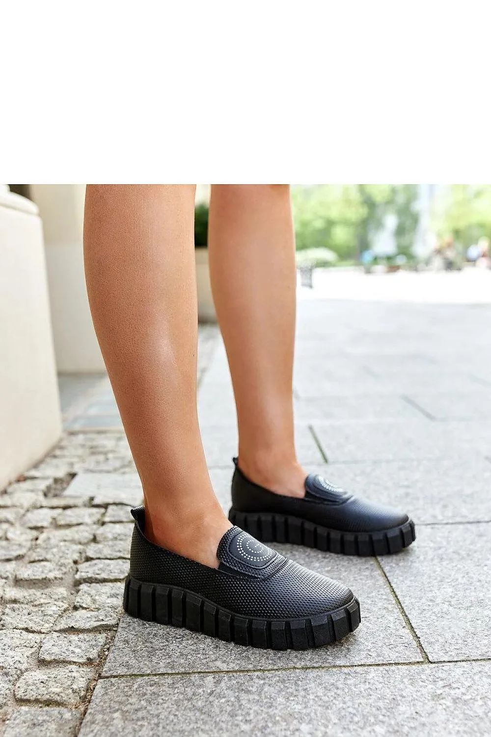 Black loafers on a massive sole