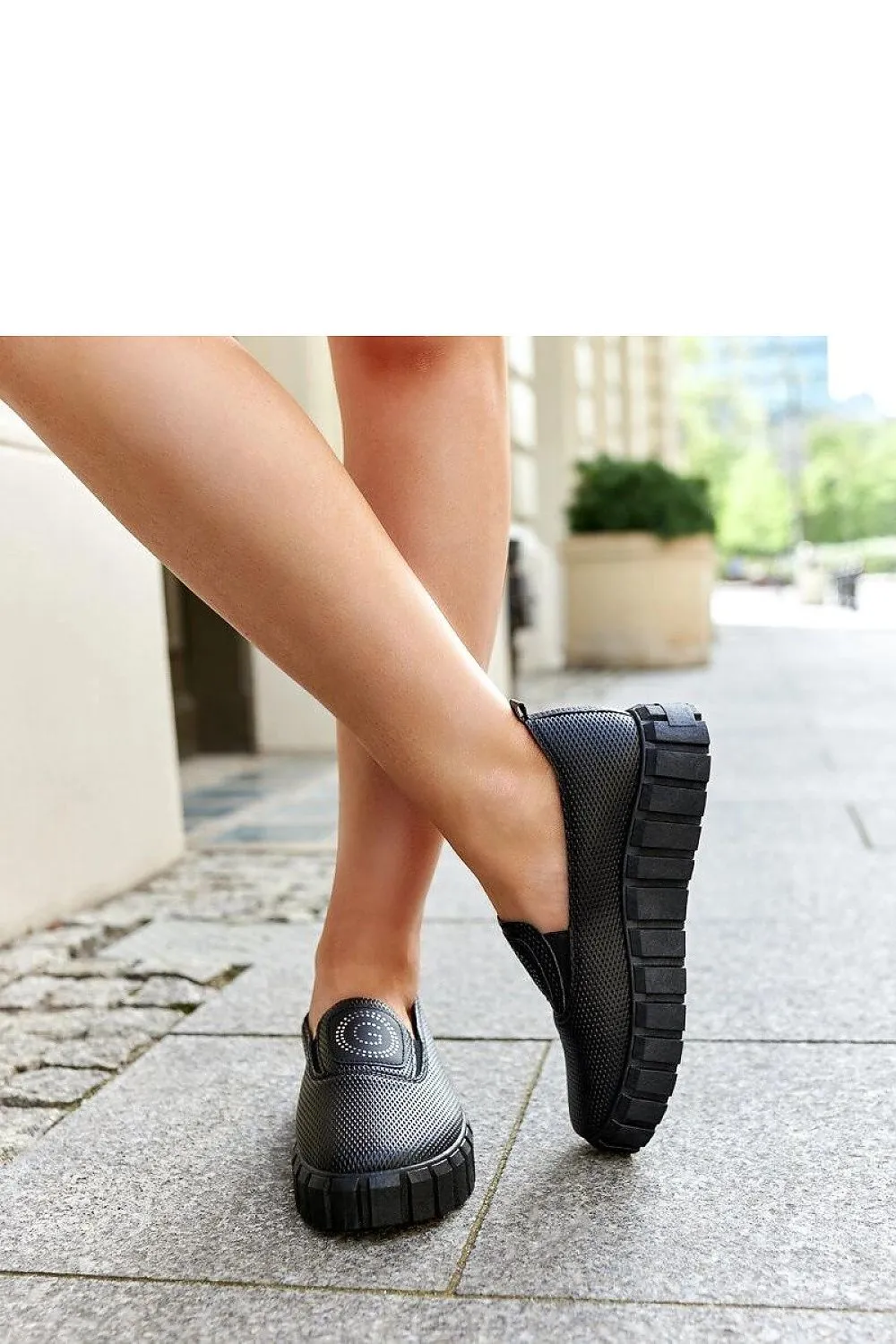 Black loafers on a massive sole