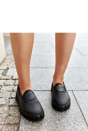 Black loafers on a massive sole