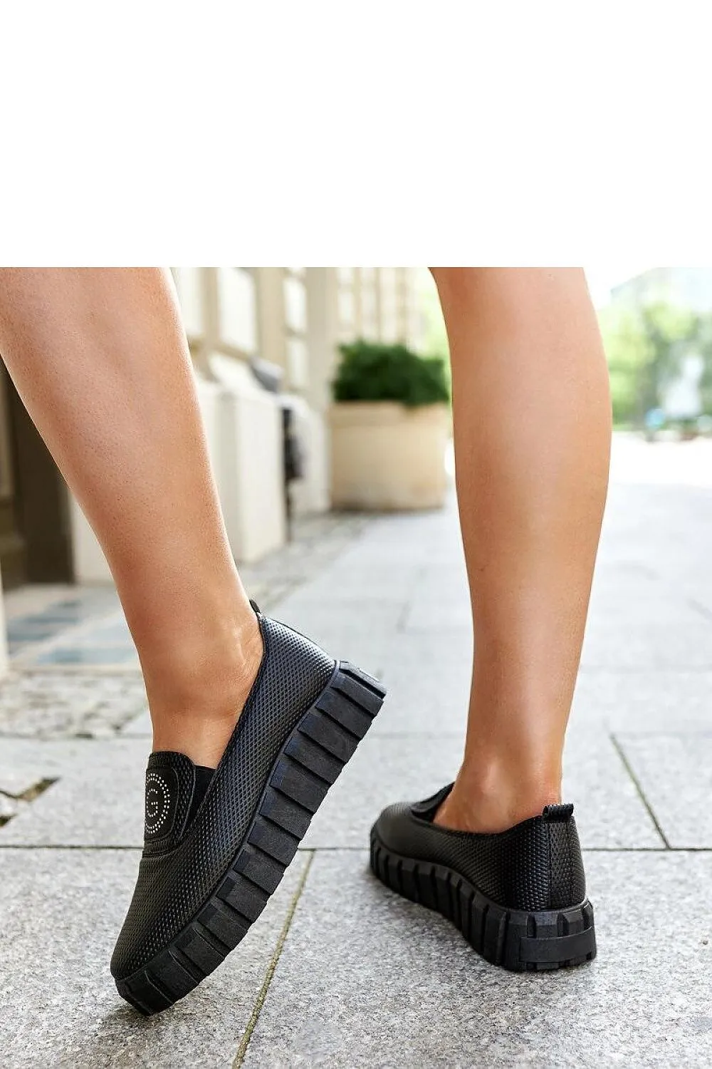 Black loafers on a massive sole