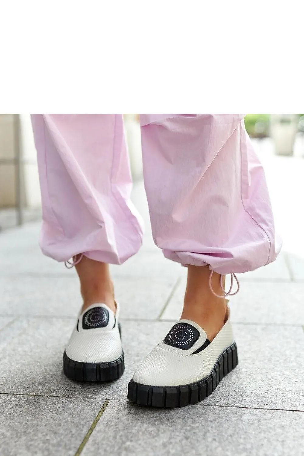 Black loafers on a massive sole